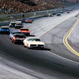 Feb 28, 1971; Ontario, CA, USA; FILE PHOTO; NASCAR Grand National Series driver Buddy Baker (11) leads the field into turn one at the 1971 Miller High Life 500 at Ontario Motor Speedway. Mandatory Credit: Darryl Norenberg-Imagn Images