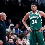 Milwaukee Bucks head coach Doc Rivers speaks to Milwaukee Bucks forward Giannis Antetokounmpo (34) during the second half against the Dallas Mavericks at American Airlines Center.