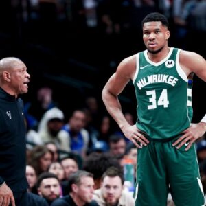Milwaukee Bucks head coach Doc Rivers speaks to Milwaukee Bucks forward Giannis Antetokounmpo (34) during the second half against the Dallas Mavericks at American Airlines Center.