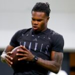 Apr 4, 2025; Boulder, CO, USA; Colorado Buffaloes wide receiver Travis Hunter (12) catches a pass at the University of Colorado NFL Showcase at the CU Indoor Practice Facility.