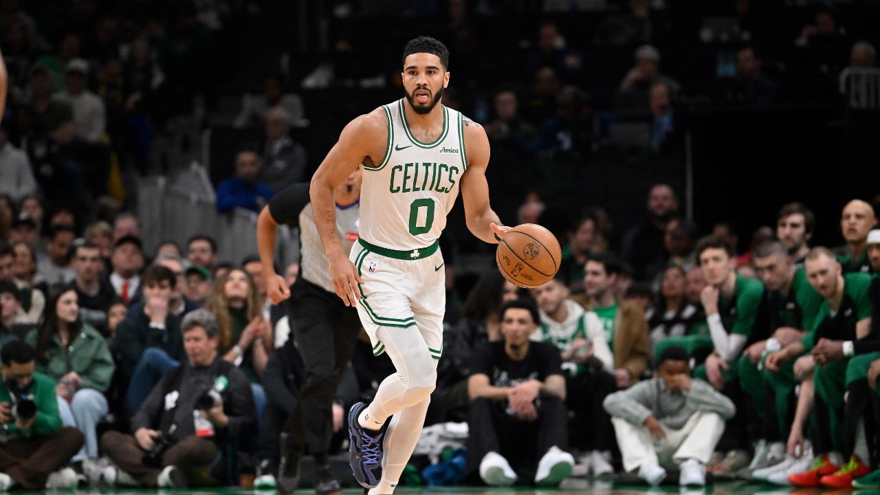 Boston Celtics forward Jayson Tatum (0) dribbles the ball against the Charlotte Hornets during the first half at TD Garden