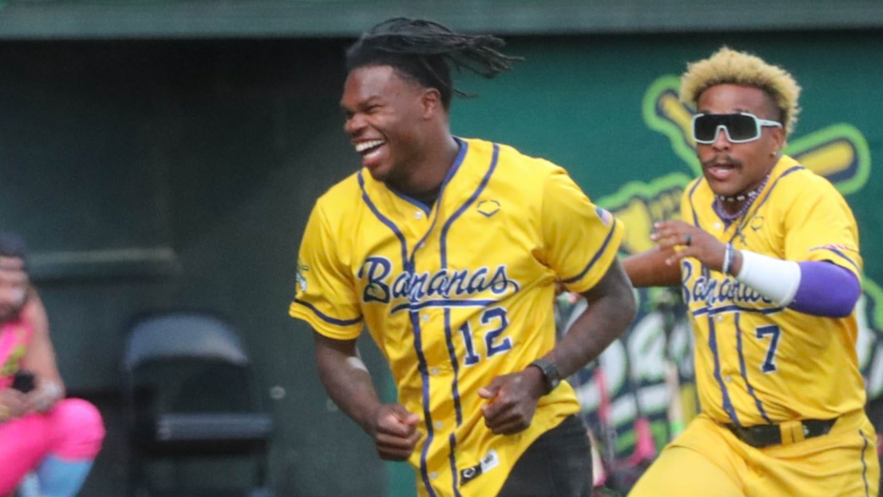 Heisman trophy winner Travis Hunter runs off the field after dancing with the Bananas during the Savannah Bananas game on Friday, April 11, 2025 at Historic Grayson Stadium.