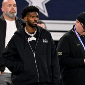 West quarterback Shedeur Sanders of Colorado (2) looks on from the sidelines during the first half against the East at AT&T Stadium.