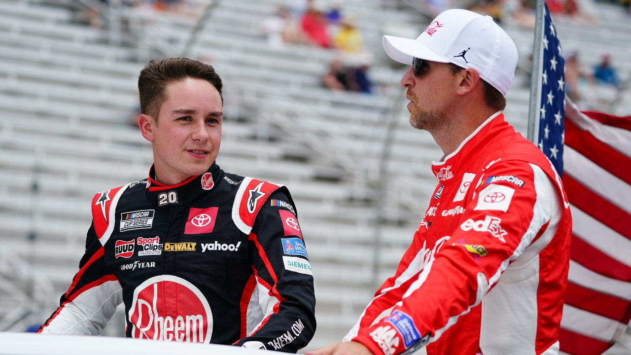 NASCAR Cup Series driver Christopher Bell (20) and NASCAR Cup Series driver Denny Hamlin (11) ride to pit road before the start of the Quaker State 400 at Atlanta Motor Speedway.