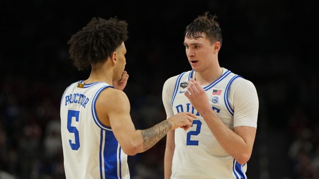 Duke Blue Devils forward Cooper Flagg (2) talks with guard Tyrese Proctor (5) after a play against the Houston Cougars during the second half in the semifinals of the men's Final Four of the 2025 NCAA Tournament at the Alamodome