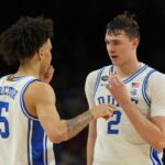 Duke Blue Devils forward Cooper Flagg (2) talks with guard Tyrese Proctor (5) after a play against the Houston Cougars during the second half in the semifinals of the men's Final Four of the 2025 NCAA Tournament at the Alamodome