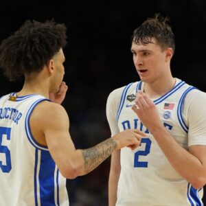 Duke Blue Devils forward Cooper Flagg (2) talks with guard Tyrese Proctor (5) after a play against the Houston Cougars during the second half in the semifinals of the men's Final Four of the 2025 NCAA Tournament at the Alamodome