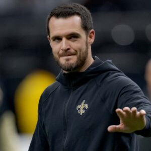 New Orleans Saints quarterback Derek Carr (4) walks the field before a game against the Las Vegas Raiders at Caesars Superdome.