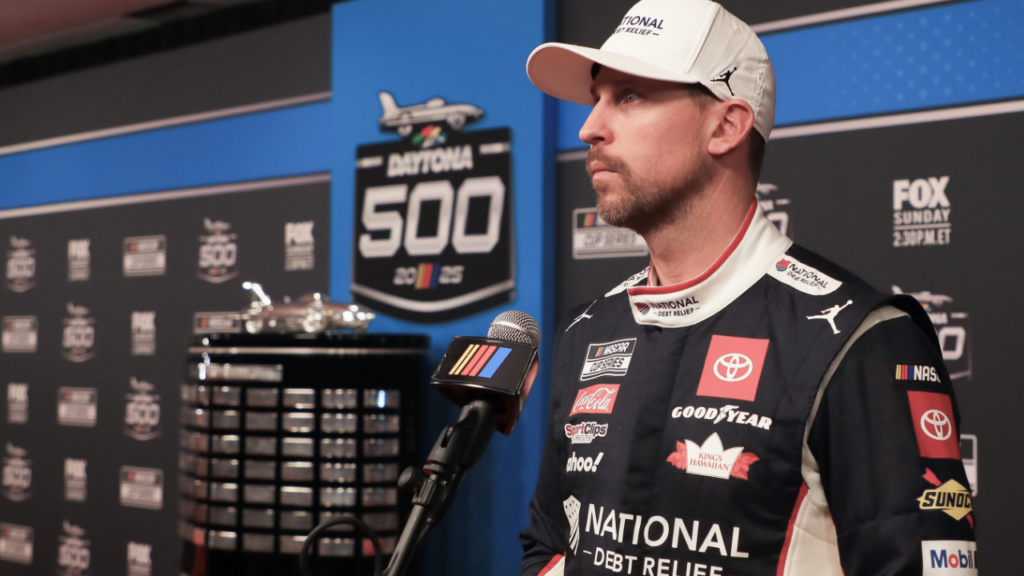 Denny Hamlin talks with the press on the red carpet during NASCAR media day on Wednesday, Feb.12, 2025.
