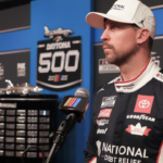Denny Hamlin talks with the press on the red carpet during NASCAR media day on Wednesday, Feb.12, 2025.