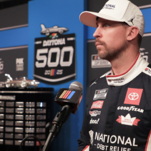 Denny Hamlin talks with the press on the red carpet during NASCAR media day on Wednesday, Feb.12, 2025.