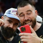 Mar 5, 2024; Cleveland, Ohio, USA; Cleveland natives and NFL players Travis, right, and Jason Kelce celebrate after the Cleveland Cavaliers beat the Boston Celtics during the second half at Rocket Mortgage FieldHouse.