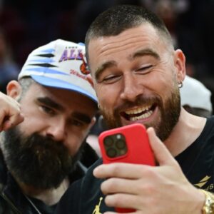 Mar 5, 2024; Cleveland, Ohio, USA; Cleveland natives and NFL players Travis, right, and Jason Kelce celebrate after the Cleveland Cavaliers beat the Boston Celtics during the second half at Rocket Mortgage FieldHouse.