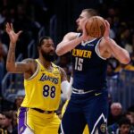 Markieff Morris (L) and Nikola Jokic (R)