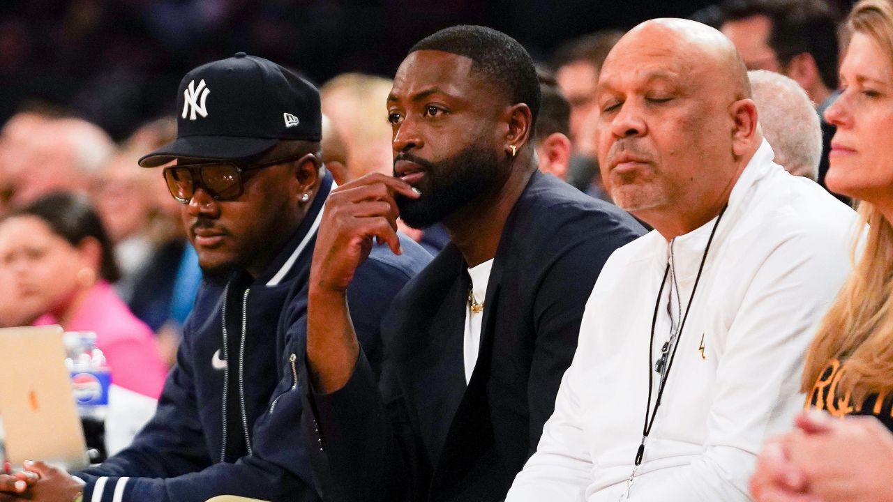 Former NBA player Dwayne Wade watches the NCAA Big East Conference Tournament quarterfinals game between the Xavier Musketeers and Marquette Golden Eagles