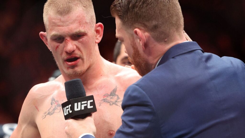 Ian Machado Garry (red gloves) reacts after defeating Carlos Prates (not pictured) during UFC Fight Night at T-Mobile Center.