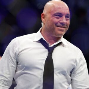 Joe Rogan after the fight between Amir Albazi (red gloves) and Francisco Figueiredo (blue gloves) during UFC 278 at Vivint Arena.