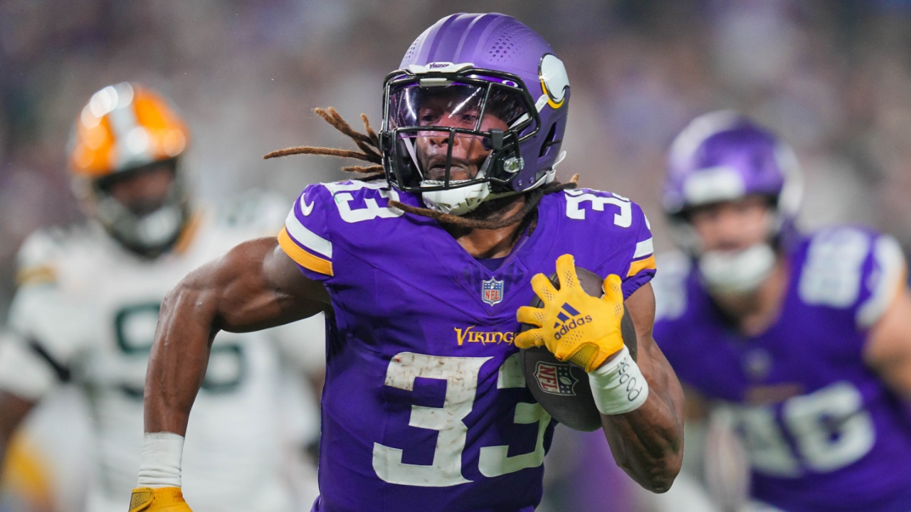 Dec 29, 2024; Minneapolis, Minnesota, USA; Minnesota Vikings running back Aaron Jones (33) runs with the ball against Green Bay Packers in the third quarter at U.S. Bank Stadium.