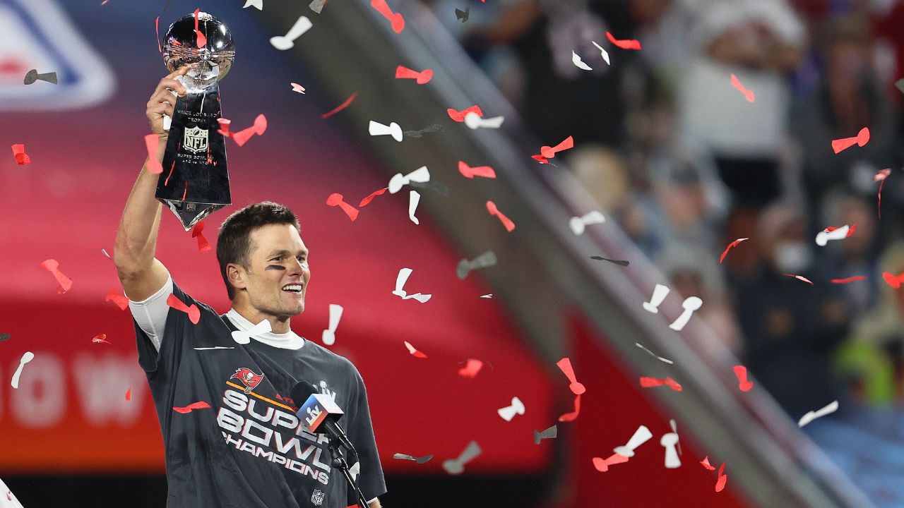 Tampa Bay Buccaneers quarterback Tom Brady (12) hoists the Vince Lombardi Trophy after defeating the Kansas City Chiefs in Super Bowl LV at Raymond James Stadium.