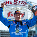 NHRA top fuel driver Tony Stewart celebrates after winning the Four Wide Nationals at The Strip at Las Vegas Motor Speedway. The win is the first of Stewarts professional drag racing career.