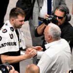 Los Angeles Lakers guard Luka Doncic (77) hugs his father Sasa Doncic after the game against the Dallas Mavericks at the American Airlines Center.