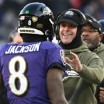 Nov 20, 2022; Baltimore, Maryland, USA; Baltimore Ravens head coach John Harbaugh greats Baltimore Ravens quarterback Lamar Jackson (8) after scoring a second half touchdown against the Carolina Panthers at M&T Bank Stadium.