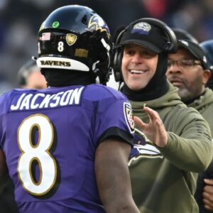 Nov 20, 2022; Baltimore, Maryland, USA; Baltimore Ravens head coach John Harbaugh greats Baltimore Ravens quarterback Lamar Jackson (8) after scoring a second half touchdown against the Carolina Panthers at M&T Bank Stadium.