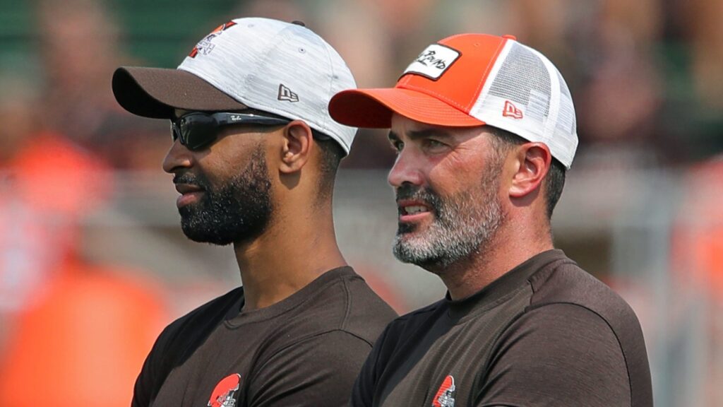 Browns GM Andrew Berry, left, and coach Kevin Stefanski watch practice in training camp, Saturday, July 31, 2021, in Berea.