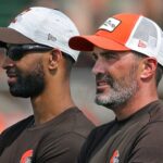 Browns GM Andrew Berry, left, and coach Kevin Stefanski watch practice in training camp, Saturday, July 31, 2021, in Berea.