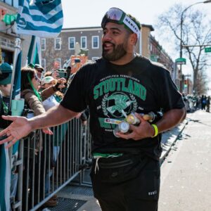 Philadelphia Eagles offensive tackle Jordan Mailata (68) celebrates during the Super Bowl LIX championship parade and rally.