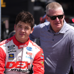 NASCAR Cup Series driver Harrison Burton (L) sits with his father Jeff Burton (C) and crew chief Brian Wilson (R) during qualifying for the Goodyear 400 at Darlington Raceway.