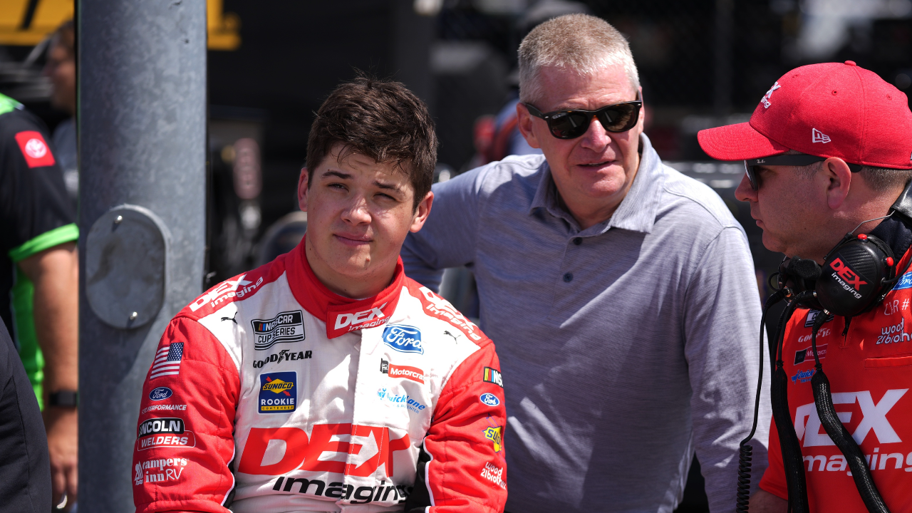 NASCAR Cup Series driver Harrison Burton (L) sits with his father Jeff Burton (C) and crew chief Brian Wilson (R) during qualifying for the Goodyear 400 at Darlington Raceway.