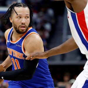 New York Knicks guard Jalen Brunson (11) is defended by Detroit Pistons forward Paul Reed (7) in the first half during game three of first round for the 2024 NBA Playoffs at Little Caesars Arena.