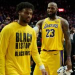 Los Angeles Lakers forward LeBron James (23) celebrates victory over the Portland Trail Blazers with his son guard Bronny James (9) at Moda Center.