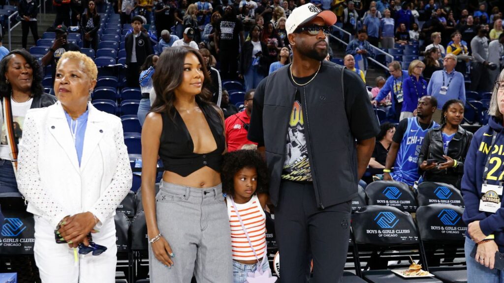 Former basketball player Dwyane Wade attends with his wife Gabrielle Union a WNBA game between the Chicago Sky and Connecticut Sun at Wintrust Arena