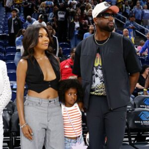 Former basketball player Dwyane Wade attends with his wife Gabrielle Union a WNBA game between the Chicago Sky and Connecticut Sun at Wintrust Arena