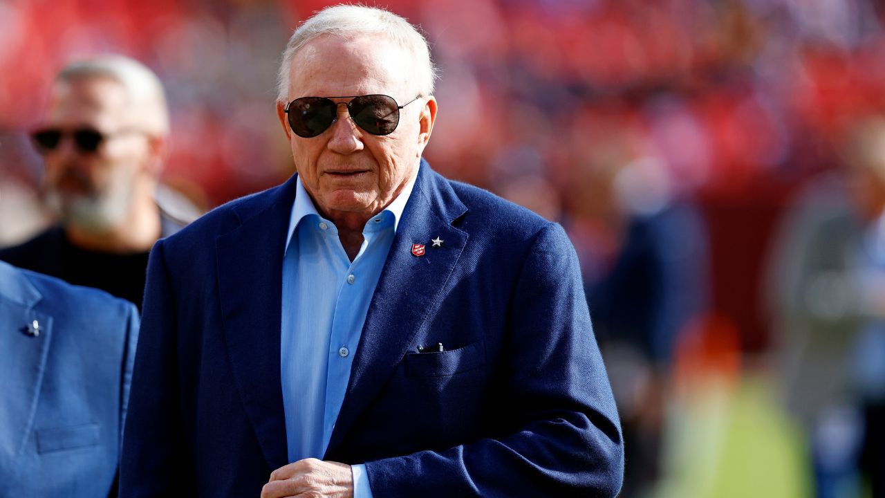 Dallas Cowboys owner Jerry Jones walks off the field before the game between the Washington Commanders and the Dallas Cowboys at Northwest Stadium.