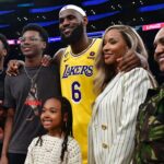 Feb 7, 2023; Los Angeles, California, USA; Los Angeles Lakers forward LeBron James (6) poses for photos with his sons Bronny and Bryce Maximus, daughter Zhuri, wife Savannah and mother Gloria after the game against the Oklahoma City Thunder at Crypto.com Arena. Mandatory Credit: Gary A. Vasquez-Imagn Images