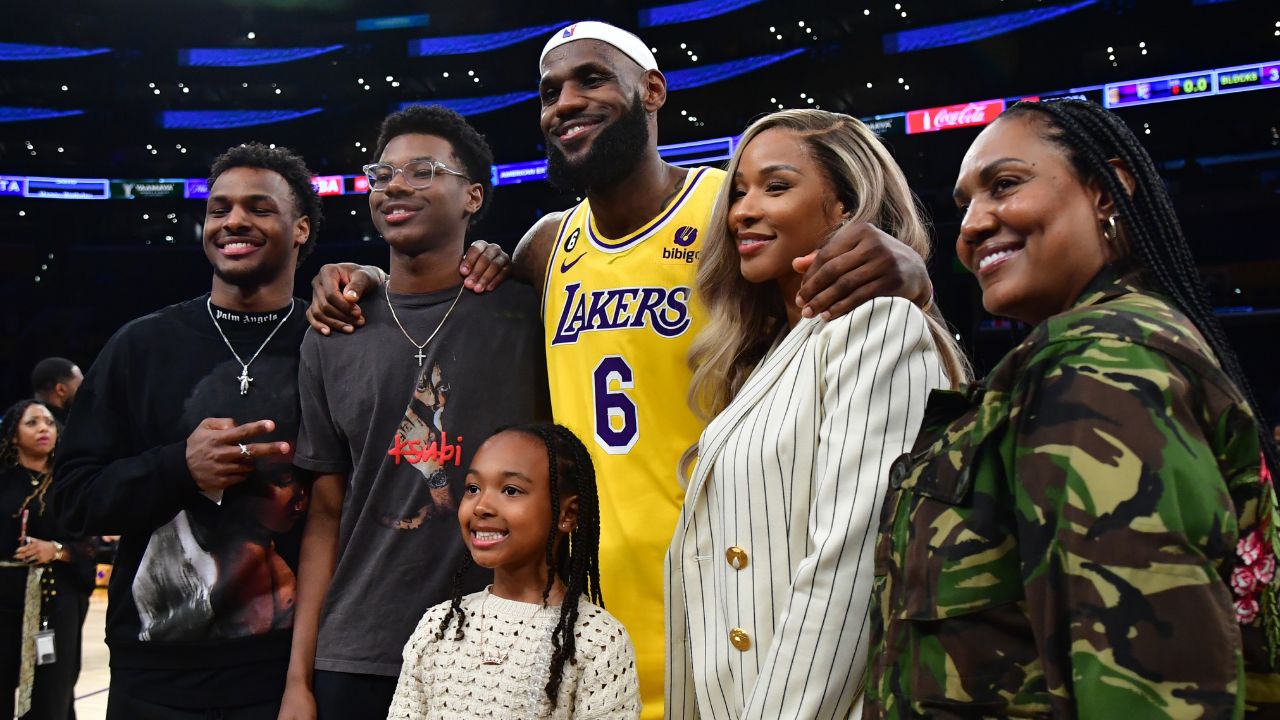 Feb 7, 2023; Los Angeles, California, USA; Los Angeles Lakers forward LeBron James (6) poses for photos with his sons Bronny and Bryce Maximus, daughter Zhuri, wife Savannah and mother Gloria after the game against the Oklahoma City Thunder at Crypto.com Arena. Mandatory Credit: Gary A. Vasquez-Imagn Images
