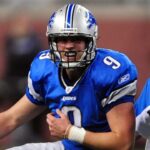 Nov 22, 2009; Detroit, MI, USA; Detroit Lions quarterback Matthew Stafford (9) holds his shoulder after getting hit while making a pass on the last play of the game at Ford Field.
