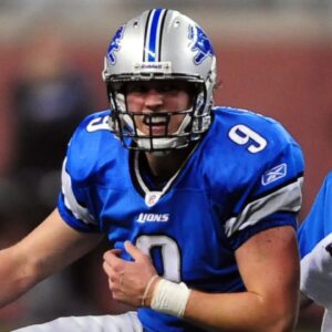 Nov 22, 2009; Detroit, MI, USA; Detroit Lions quarterback Matthew Stafford (9) holds his shoulder after getting hit while making a pass on the last play of the game at Ford Field.