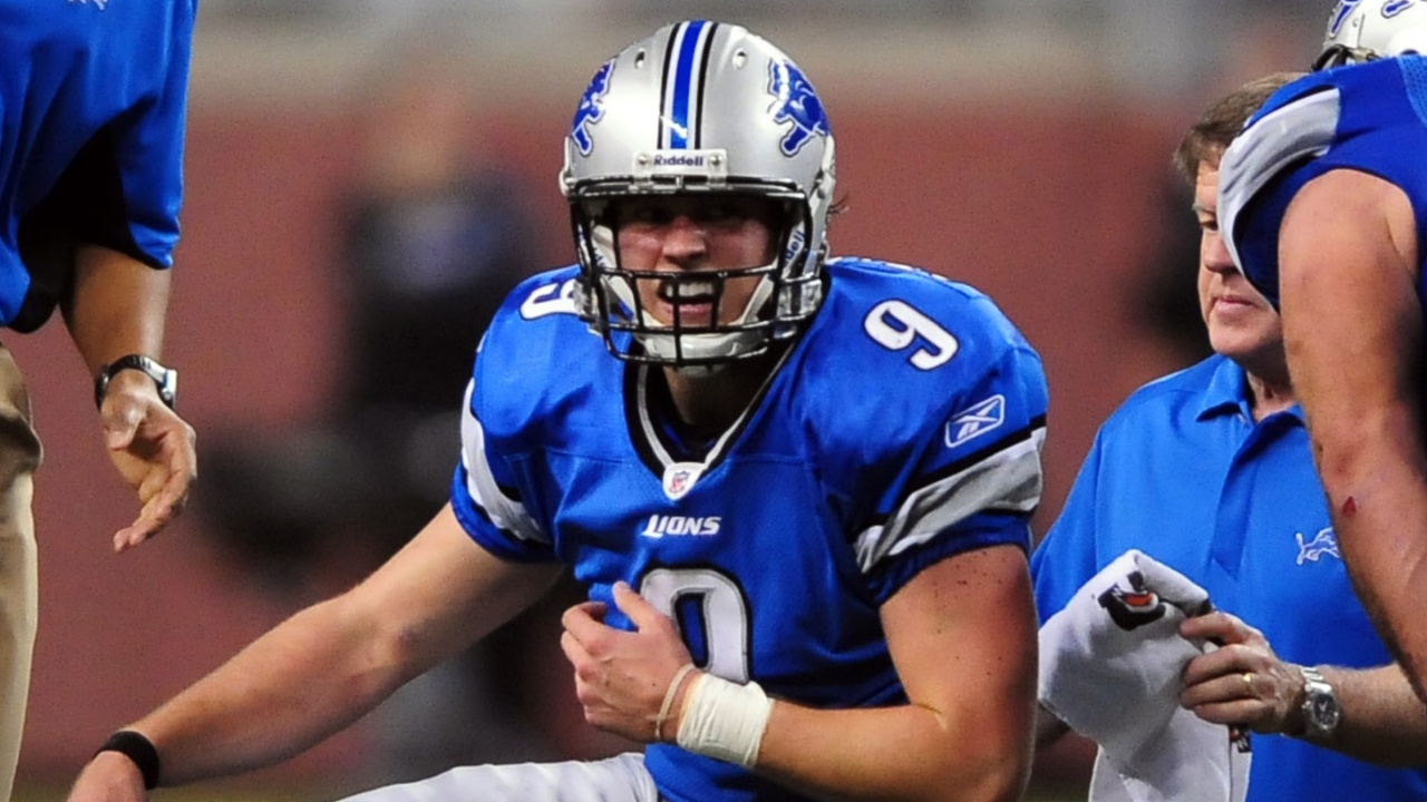 Nov 22, 2009; Detroit, MI, USA; Detroit Lions quarterback Matthew Stafford (9) holds his shoulder after getting hit while making a pass on the last play of the game at Ford Field.