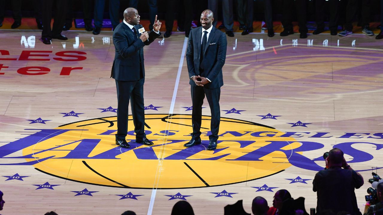 arvin \"Magic\" Johnson addresses the Staples Center crowd during a halftime ceremony retiring Kobe Bryant's two uniform numbers.