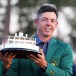 Rory McIlroy of Northern Ireland celebrates with the trophy after winning the 2025 Masters golf tournament at Augusta National Golf Club in Augusta, the United States