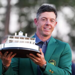 Rory McIlroy of Northern Ireland celebrates with the trophy after winning the 2025 Masters golf tournament at Augusta National Golf Club in Augusta, the United States