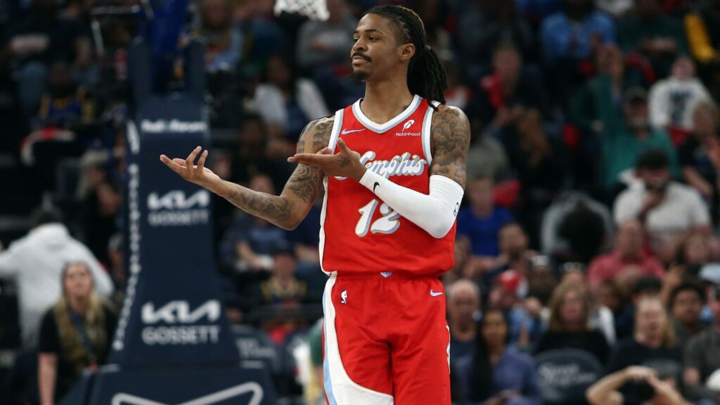 Memphis Grizzlies guard Ja Morant (12) reacts after a basket during the second quarter against the Golden State Warriors at FedExForum.