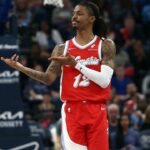 Memphis Grizzlies guard Ja Morant (12) reacts after a basket during the second quarter against the Golden State Warriors at FedExForum.
