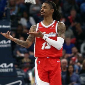Memphis Grizzlies guard Ja Morant (12) reacts after a basket during the second quarter against the Golden State Warriors at FedExForum.