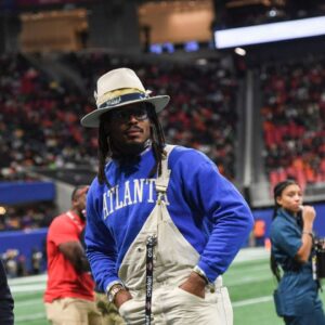 Former Auburn and NFL star Cam Newton stands on the sidelines during the Cricket Celebration Bowl game between Florida A&M University and Howard University at Mercedes-Benz Stadium in Atlanta on Dec. 16, 2023.