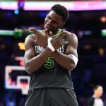 Minnesota Timberwolves guard Anthony Edwards (5) reacts after scoring against the Philadelphia 76ers in the fourth quarter at Wells Fargo Center.